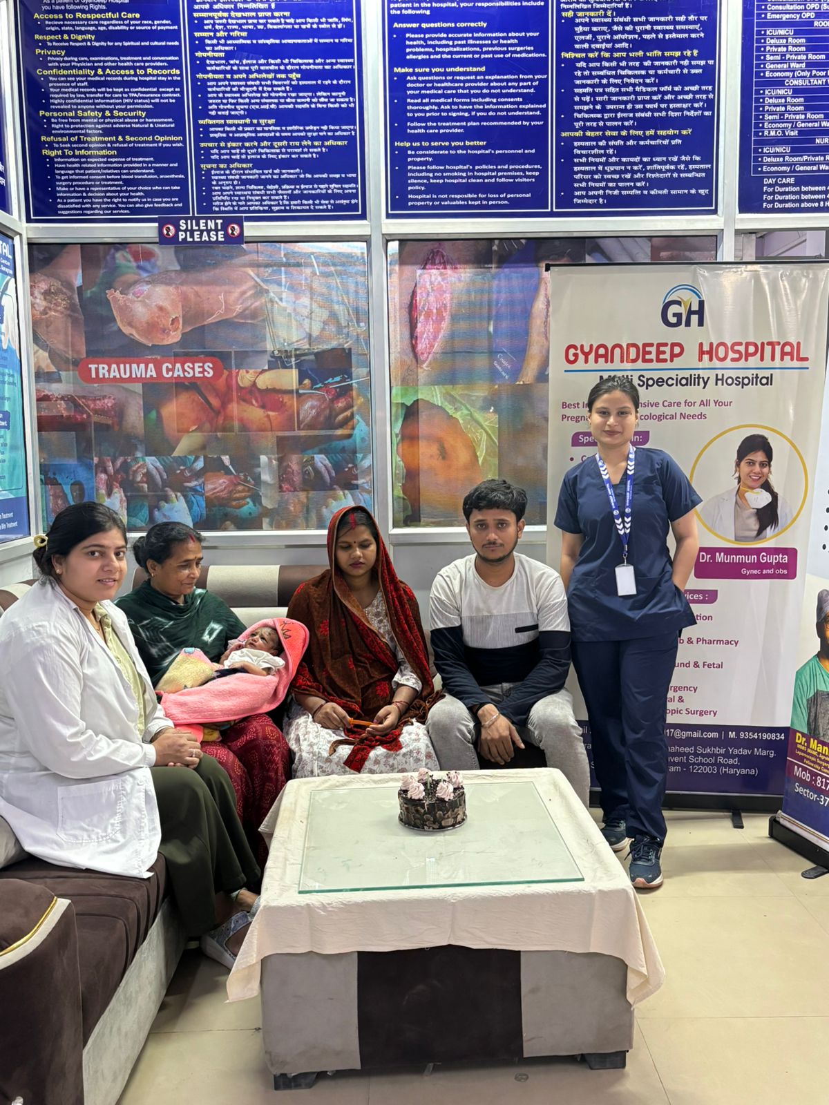 Nursing staff with newborn baby and family